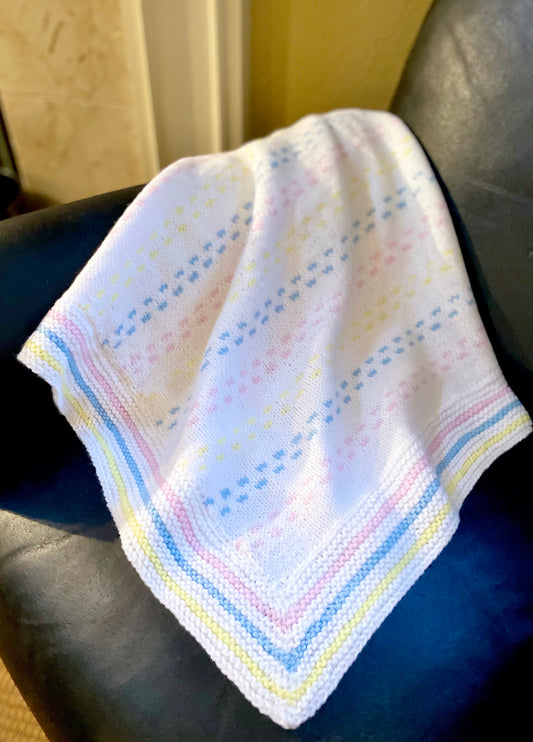 Delicate pastel colors of pink, blue and yellow mixed with snowy white, in the softest up-cycled acrylic yarns, create the perfect baby blanket for your special little one. Dimensions: 36" x 36" Hand wash, Line dry Handmade with love in the USA
