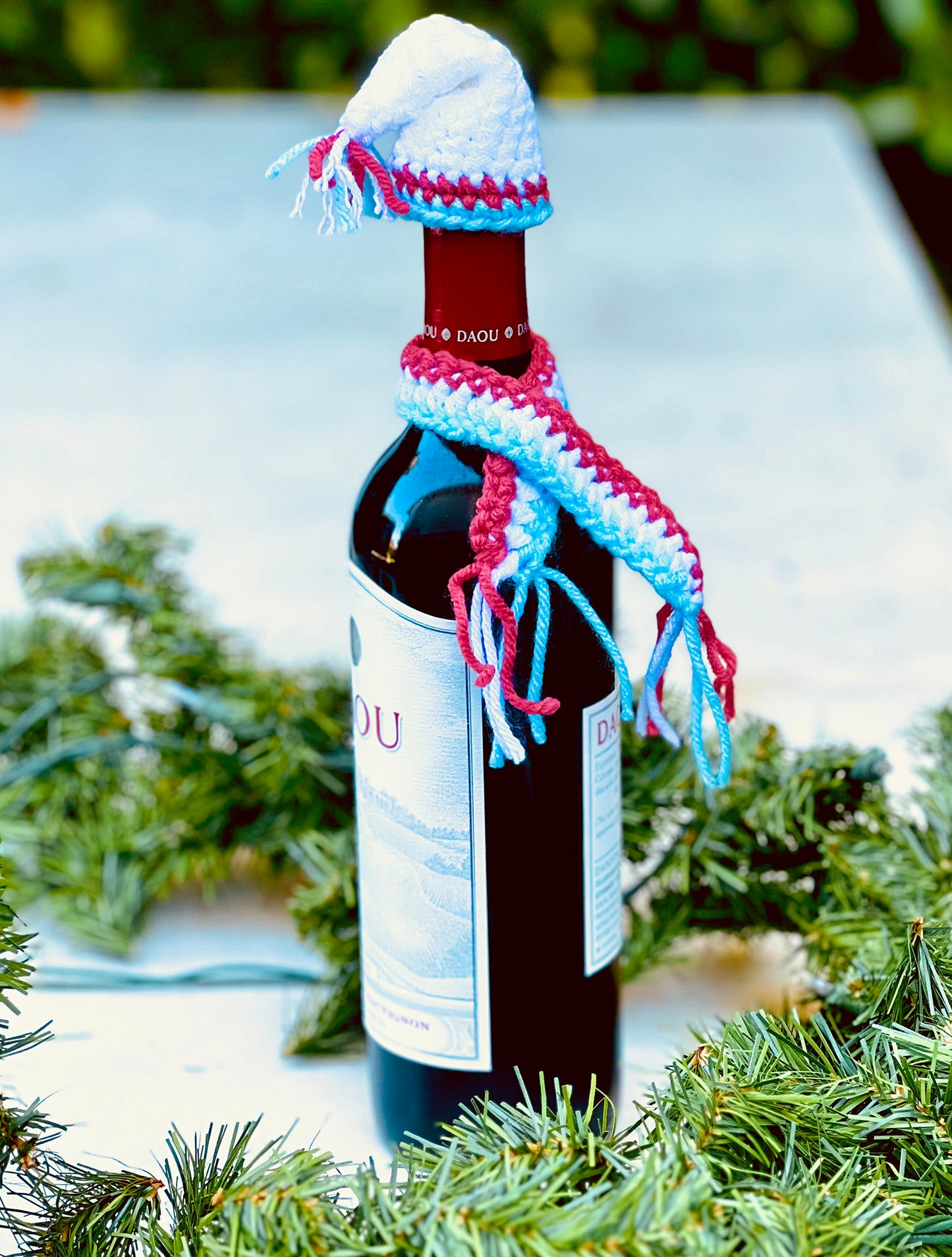 These knitted wine bottle topper hat & scarf sets make gift giving more fun. Made from upcycled acrylic yarn in three different festive styles. Made to order, please allow 3 to 7 days depending how many sets are ordered. Colors may also vary depending on availability. Acrylic yarn Hand wash cold, line dry Handmade in California