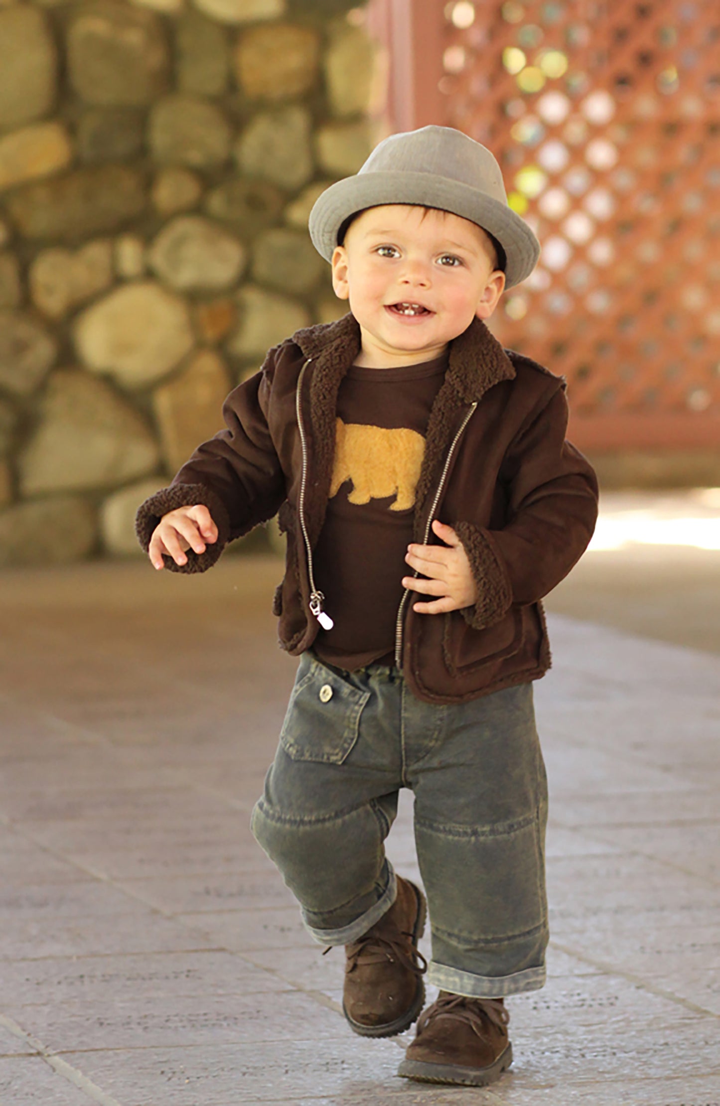 Boys favorite aviator jacket in super soft suede and fleece, has slightly longer sleeves so they can be rolled up or left down. Tone on tone suede and fleece in coffee brown, or two tone charcoal black suede with dove grey fleece. Faux zipper, along with two front pockets keep winter hands cozy and warm. Machine wash cold, line dry Made in the USA