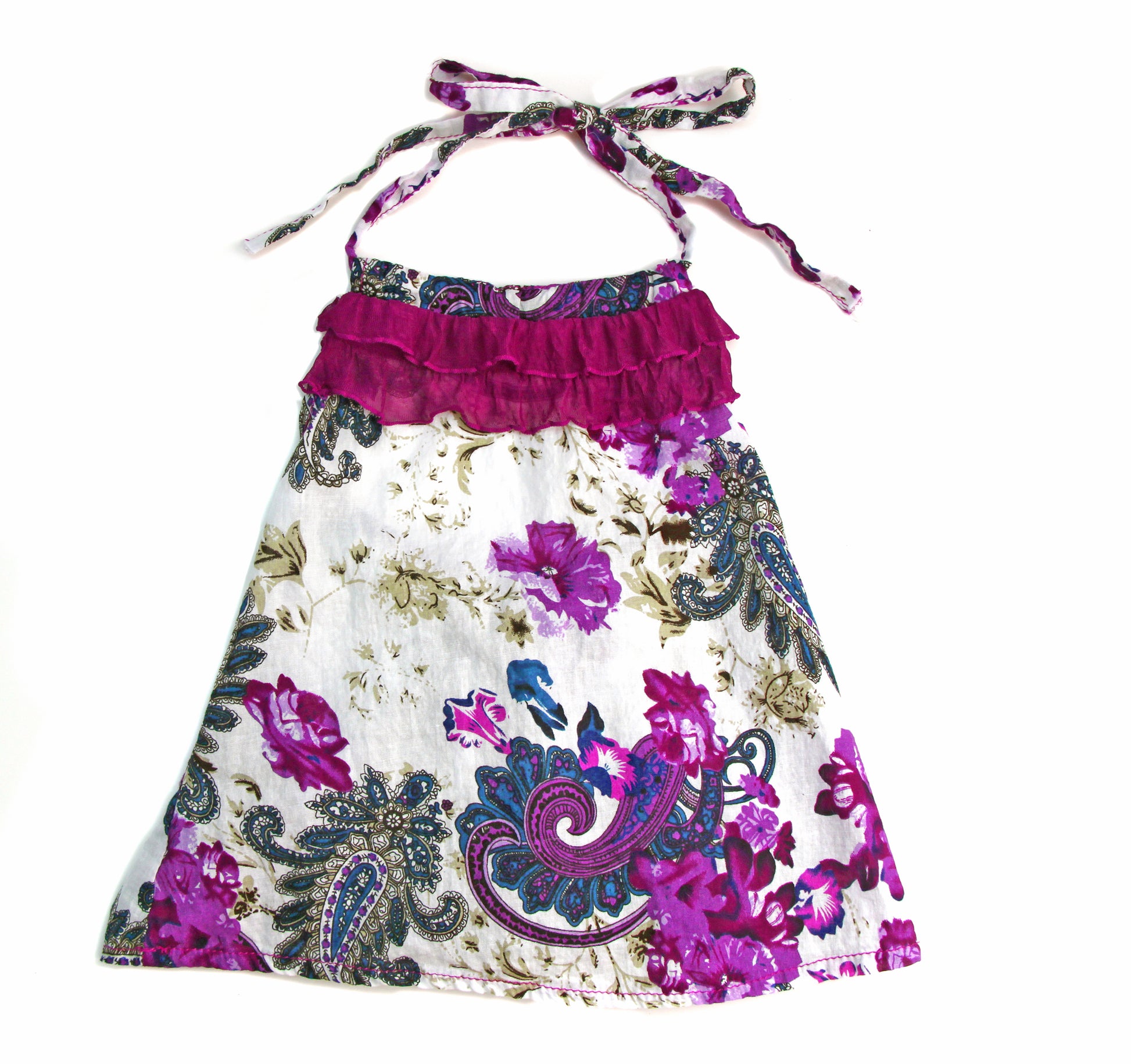 Colorful purple paisley-floral print on soft, light weight cotton woven fabric.  A-line cut halter with delicate ruffle neckline, tie back, and soft elastic to stay in place.  Pair with the Gatsby Girl Capri pant for a comfy, summer fun look.          100% cotton woven     Hand wash or machine wash delicate cycle, cold. Dry low heat or Line dry.     Made in the USA