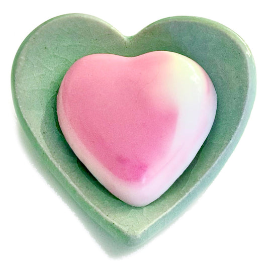 Hydrating Heart Soap  https://www.handmadeonmarviasquare.com/products/hydrating-heart-soap  Your skin will love the silky smooth feeling from these hydrating heart soaps by Patrice Angel Healing. Hand poured with Aloe vera and Mimosa scented shea butter. Each unique in design, so that no two soaps are alike. Dimensions: 3" x 3" Color: Rose & White Blend Handmade in California