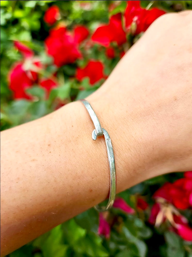 This unique design by Randi M., symbolizes the infinite bond with friends and loved ones.  Add a personal touch with your loved ones' name(s), words of inspiration, or a favorite quote, that would be hand stamped on either outside or inside of the bracelet. Simply send an email with your request and allow 2-3 days to create your personalized piece.      Easy hook & unhook design     7" diameter     Handmade in California