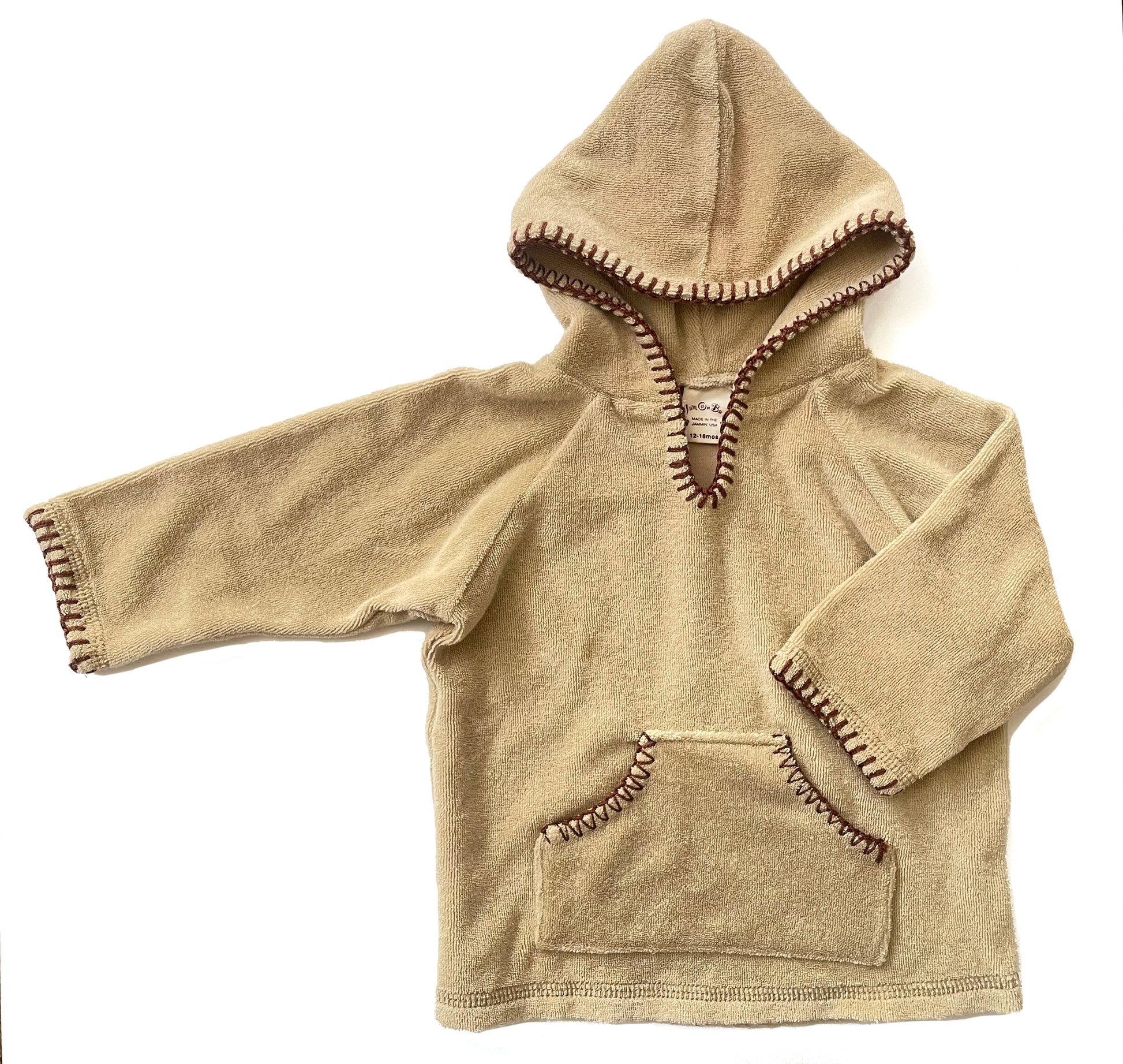 Cozy cover up 'aprés beach' set in the softest, cotton terry fabric with blanket stitch trim detail on both hoodie and elastic waist pant. Kanga pocket on hoodie for little treasures. Fabric color: Sand / Trim color: Chocolate 85% Cotton / 15% Poly Machine washable, cold. Dry on low heat. Made in California