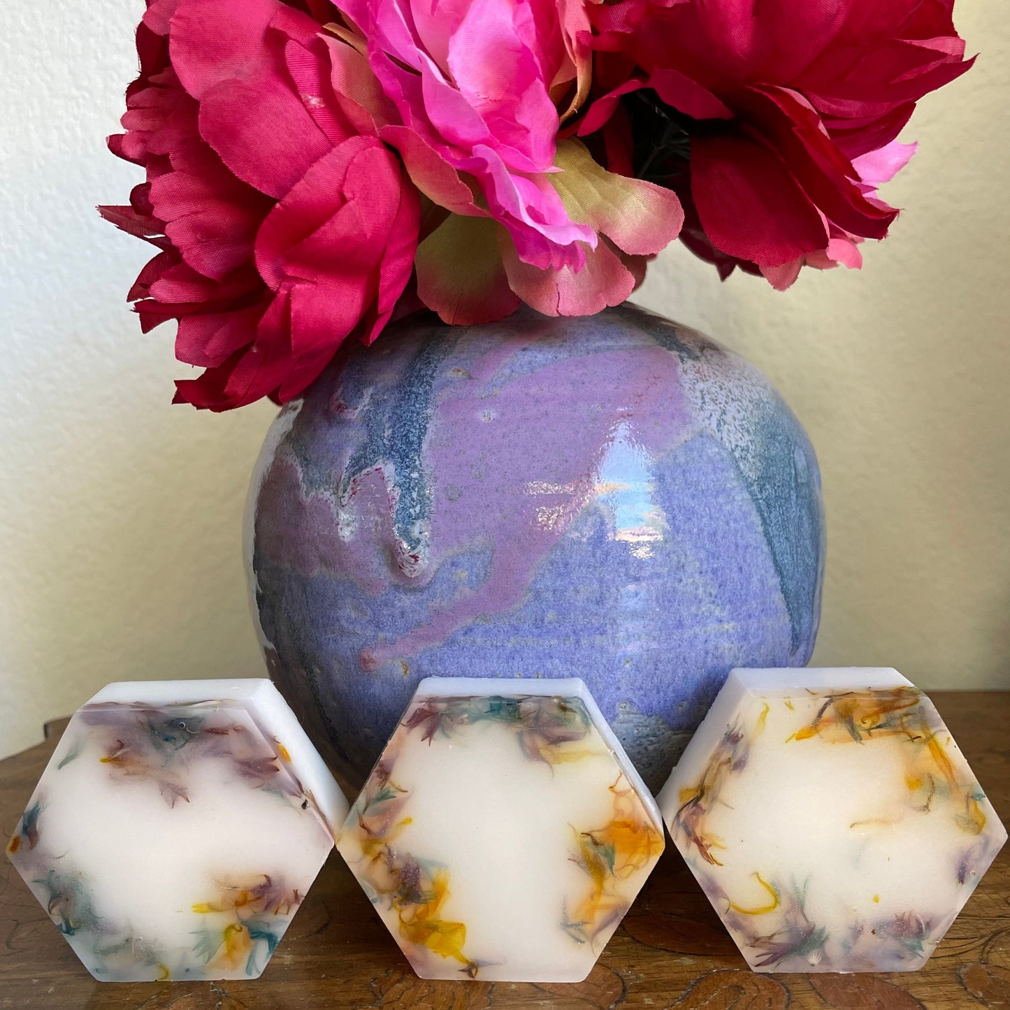 https://handmadeonmarviasquare.com/products/patrices-angel-healing-soap  Beautiful wildflower scented essential oil, hexagon shaped soap. Blended with Shea butter, coconut oil, marigold petals, blue and pink cornflower petals that will indulge your skin in pure and natural moisture.