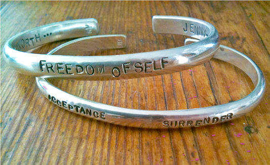 Hand stamped silver cuff bracelet.  Your choice of an inspiring quote or names of your loved ones, will add a personal touch to this timeless piece.  Both sides of the bracelet can be personalized.