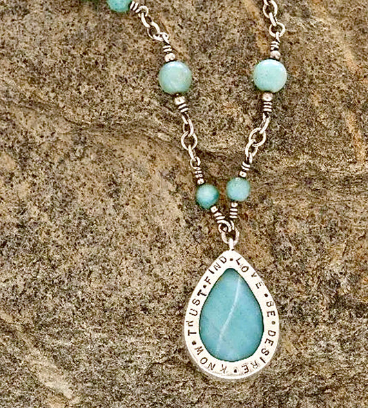 Teardrop Necklace by BeLoved Jewelry Co.  https://handmadeonmarviasquare.com/products/personalized-necklace-by-randi  Personalized silver teardrop chain necklace with amazonite. 30" long and can be ordered in other semi-precious and precious stones in a variety of colors depending upon availability. Please inquire.